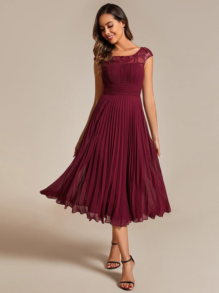 Chic A-Line Chiffon Wedding Guest Dress with Cap Sleeves and Pleats.