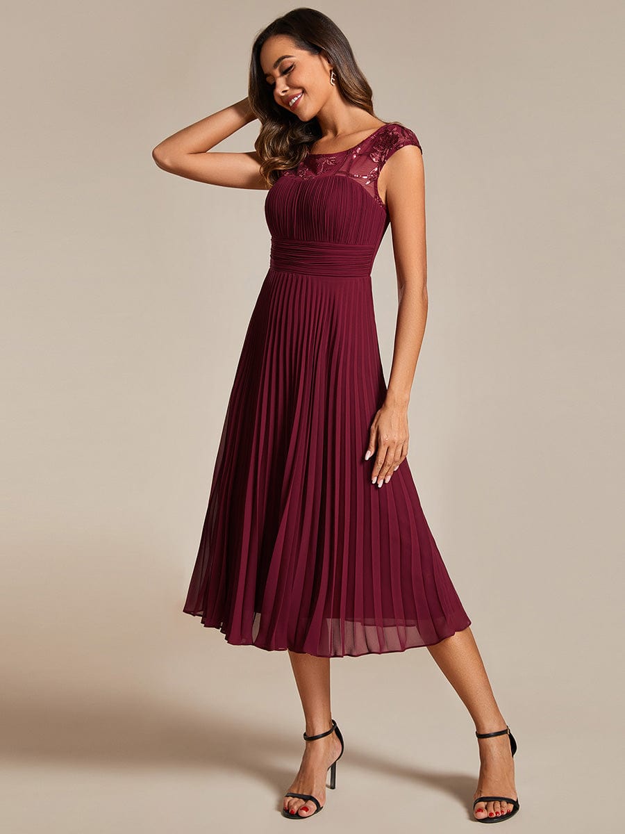 Chic A-Line Chiffon Wedding Guest Dress with Cap Sleeves and Pleats.