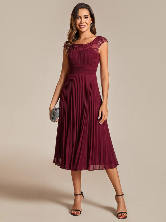 Chic A-Line Chiffon Wedding Guest Dress with Cap Sleeves and Pleats.