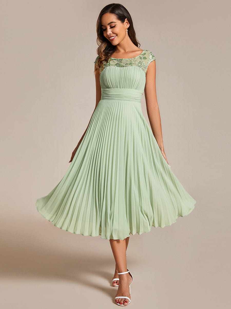 Chic A-Line Chiffon Wedding Guest Dress with Cap Sleeves and Pleats.