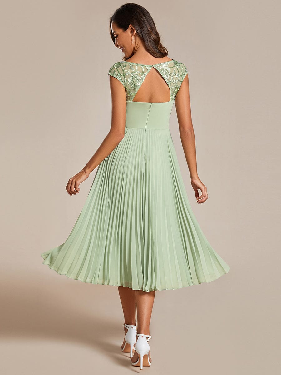 Chic A-Line Chiffon Wedding Guest Dress with Cap Sleeves and Pleats.