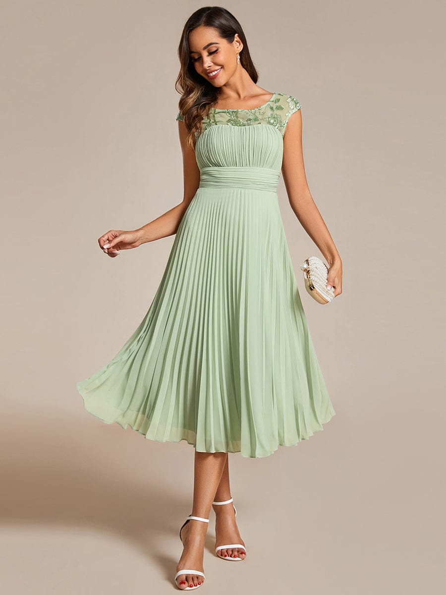 Chic A-Line Chiffon Wedding Guest Dress with Cap Sleeves and Pleats.