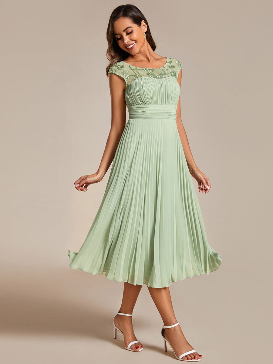 Chic A-Line Chiffon Wedding Guest Dress with Cap Sleeves and Pleats.