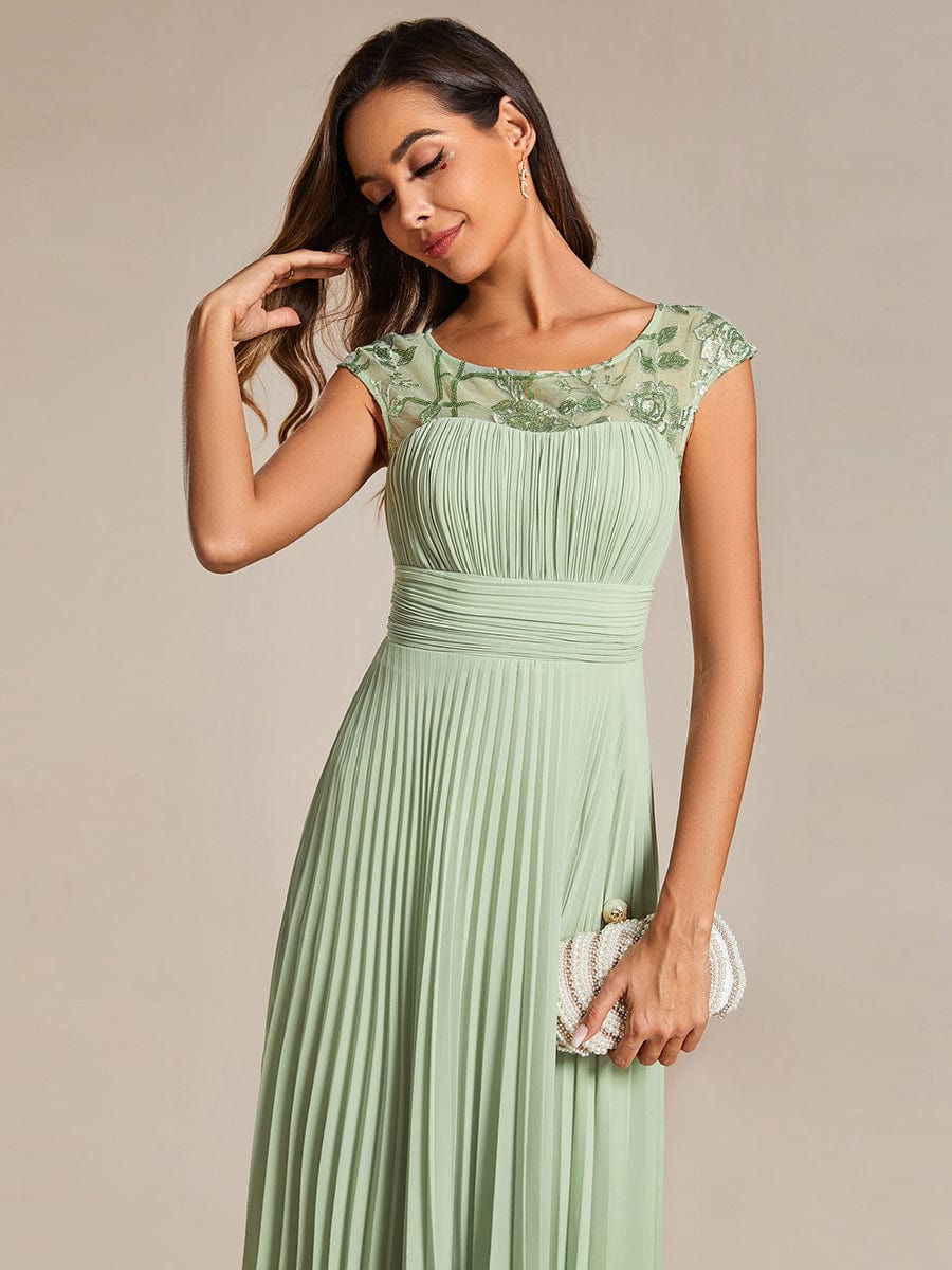 Chic A-Line Chiffon Wedding Guest Dress with Cap Sleeves and Pleats.